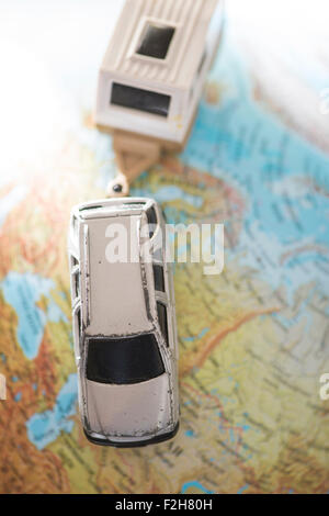 Car and caravan on globe. Miniature concept Stock Photo