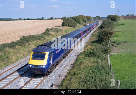 First Great Western HST headed by 43027 speeds West through Bourton Nr Swindon on the GWML with 1B37 1315 London Paddington to C Stock Photo