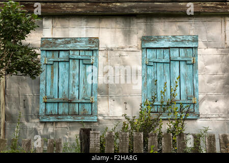 Tin House with wooden windows Stock Photo