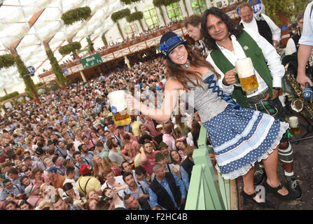 Munich, Germany. 19th Sep, 2015. Actress Christine Neubauer and her boyfriend Jose Campos pose at the 182nd Oktoberfest in Munich, Germany, 19 September 2015. The world's largest beer festival which will run until 04 October 2015 is expected to attract some six million visitors from all over the world this year. Photo: FELIX HOERHAGER/dpa/Alamy Live News Stock Photo