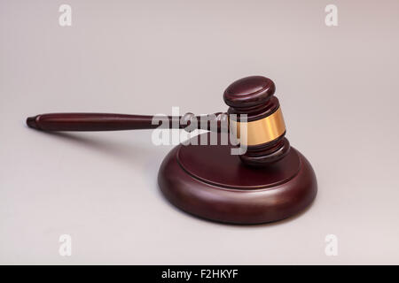 Wooden judge gavel and soundboard isolated on gray background Stock Photo