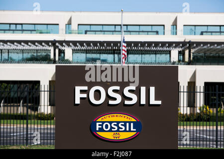 A logo sign outside of the headquarters of Fossil Group, Inc., in Stock ...