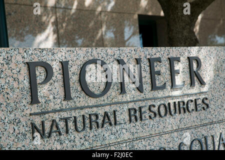 A logo sign outside of the headquarters of the Pioneer Natural Resources Co., in Irving, Texas on September 13, 2015. Stock Photo