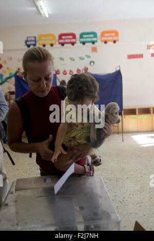 Athens, Greece. 20th Sep, 2015. A woman casts her vote at a polling station in Athens, capital of Greece, on Sept. 20, 2015. Greek voters started casting their ballots Sunday in the second general elections this year to elect a new government that will implement the latest three year bailout agreed in the summer with international creditors. Credit:  Marios Lolos/Xinhua/Alamy Live News Stock Photo