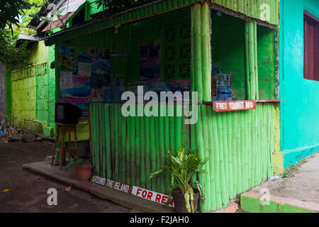 A tourist and tour booth greets the ferry dock of Moyogalpa, Ometepe Nicaragua with a dramatic sky Stock Photo