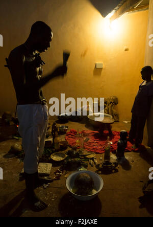 Benin, West Africa, Bonhicon, kagbanon bebe voodoo priest praying in the night during a ceremony Stock Photo