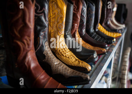 Hand stitched leather cowboy boots for sale during the annual fiesta in Juigalpa, Nicaragua.A festival of bulls cows and cowboys Stock Photo