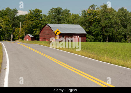 A dutch style barn on a country road in Berne, New York State, U.S.A. Stock Photo