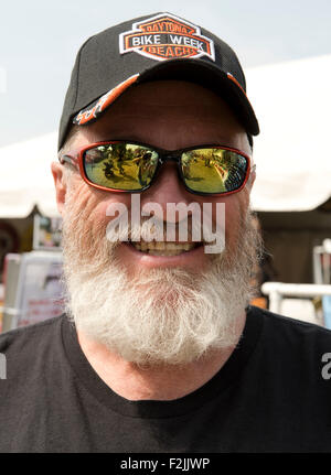 A man in mirrored sun glasses and beard at the Washington County Fair in Greenwich, New York State, U.S.A. Stock Photo