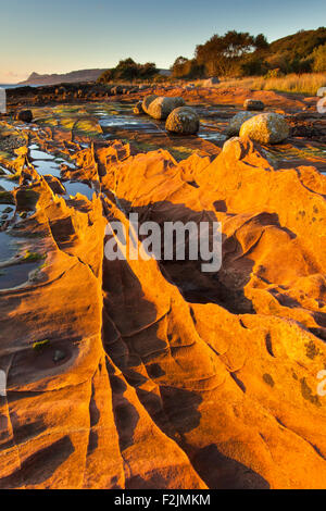 Sandstone rocks in morning light, Isle of Arran. Scotland Stock Photo