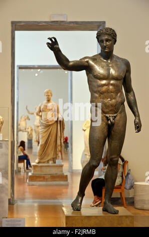 Bronze statue of a youth from the Antikythera shipwreck (340-330 BC) in the National Archaelogical Museum, Athens, Greece. Stock Photo