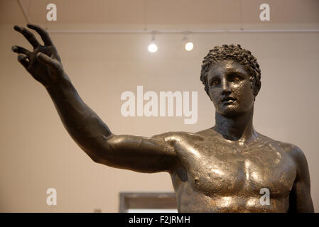 Bronze statue of a youth from the Antikythera shipwreck (340-330 BC) in the National Archaelogical Museum, Athens, Greece. Stock Photo