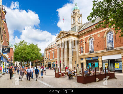 Shops on Bridge Street in the city centre with the Town Hall to the right, Peterborough, Cambridgeshire, England, UK Stock Photo