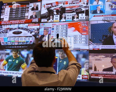 Athens, Greece. 20th Sep, 2015. Press representatives see the first exit polls for the general elections on the Press center. Credit:  George Panagakis/Pacific Press/Alamy Live News Stock Photo