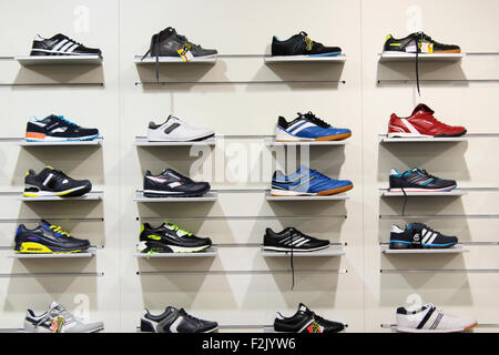 a lot of sneakers selling in the shop Stock Photo