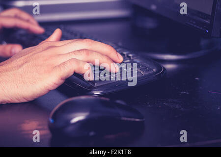 Man's hand using computer Stock Photo