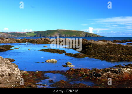 Calm Rockpool on a bright sunny day at National Trust Wembury Beach, Devonshire Coast, South West England Stock Photo