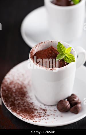 Dark chocolate pudding served in small cups Stock Photo