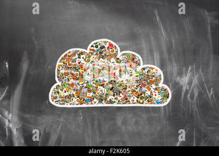 Cloud computing concept. Many photos inside a cloud on blackboard Stock Photo
