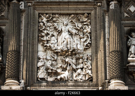 The southern facade of the Metropolitan Tabernacle features ornate depictions of the Eucharist with images of the Apostles, Church Fathers, saints who founded religious orders, martyrs as well as scenes from the Bible. Adjacent to the Metropolitan Catheral, facing the Zocalo, the Metropolitan Tabernacle (Spanish: Sagrario Metropolitana) was built by Lorenzo Rodríguez in the Baroque style between 1749 and 1760. It was designed to to house the archives and vestments of the archbishop. It also functioned and continues to function as a place to receive Eucharist and register parishioners. Stock Photo