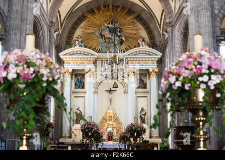 The nave and main altar of the Metropolitan Tabernacle. Adjacent to the Metropolitan Catheral, facing the Zocalo, the Metropolitan Tabernacle (Spanish: Sagrario Metropolitana) was built by Lorenzo Rodríguez in the Baroque style between 1749 and 1760. It was designed to to house the archives and vestments of the archbishop. It also functioned and continues to function as a place to receive Eucharist and register parishioners. Stock Photo