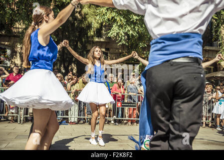 Barcelona, Catalonia, Spain. 20th Sep, 2015. Dancers take part in the 65th edition of the 'Sardanes groups' competition dancing a 'long sardana' during Barcelona's city festival, 'La Merce' 2015. The 'sardana' is a type of circle dance typical of the Catalan culture and a national symbol. Credit:  Matthias Oesterle/ZUMA Wire/Alamy Live News Stock Photo