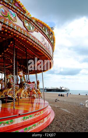View of Brighton Pier from the carousel on Brighton beach Stock Photo