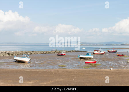 A sunny September day in Morecambe, walking along the coast looking at the sea and boats with the tide out Stock Photo