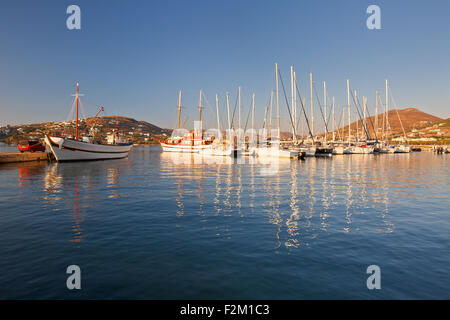 Fishing boat and sail boats in the port of Parikia, the capital and main port of Paros island in Greece,. Stock Photo