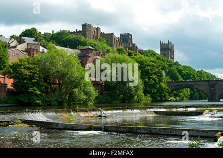 Durham Castle, the Cathedral and Framwellgate Bridge from the river Wear riverside path, Durham City, England, UK Stock Photo