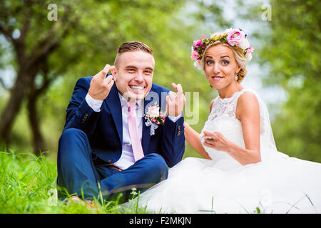 Beautiful young wedding couple outside in nature Stock Photo