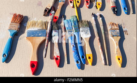 Dirty old paint brushes on the table Stock Photo