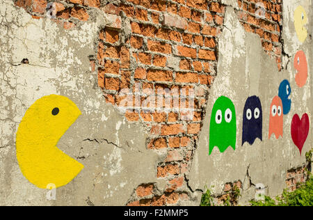 Old arcade game, painted on a wall. Stock Photo