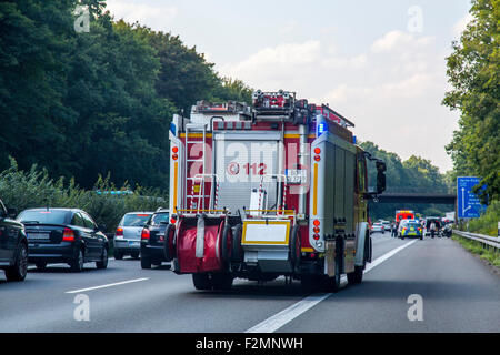 Accident on the Autobahn A 43, cars on the left and right side of the lane, to create an emergency lane for rescue services, Stock Photo