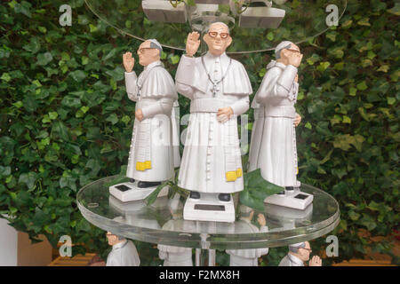 New York, USA. 21st September, 2015. Solar powered figurines of Pope Francis for sale in a convenience store in New York on Monday, September 21, 2015. Pope Francis, the Holy Father, New York as part of his U.S. trip. While in New York he will also visit Central Park, pray at St. Patricks', address the United Nations and lead a mass at Madison Square Garden. The Pope will be in the U.S. from Sept. 22 visiting Washington DC, New York and Philadelphia. Credit:  Richard Levine/Alamy Live News Stock Photo