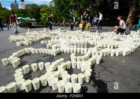 New York, USA. 21st September, 2015. Electro Lumin Escense : a disruption of space. An installation by Sonia Mena, for World Peace Day, where each of the 2400 cups of water is intended to represent a person killed by a drone in Pakistan, Somalia or Yemin, since 2004. Credit: Stacy Walsh Rosenstock/Alamy Live News Stock Photo