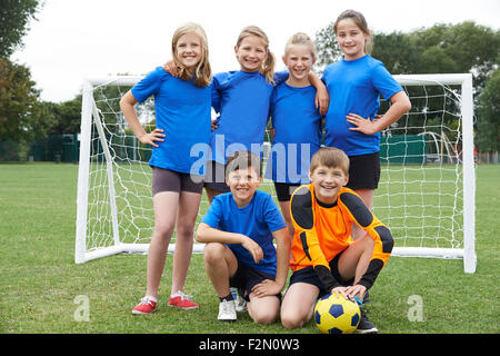 Boys And Girls In Elementary School Soccer Team Stock Photo