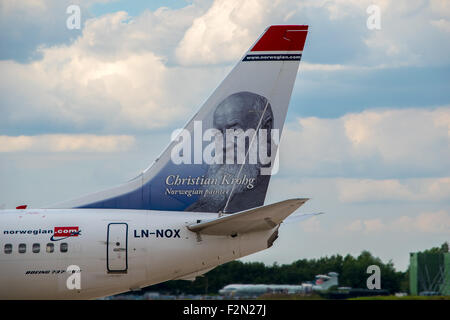 MANCHESTER, UNITED KINGDOM - AUG 07, 2015: Norwegian Air Boeing 737 tail livery. Tail shows picture of Christian Krohg Stock Photo