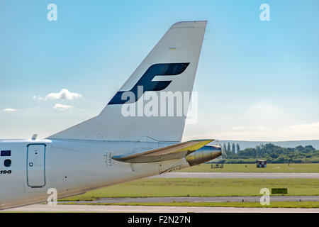 MANCHESTER, UNITED KINGDOM - AUG 07, 2015: Finnair Embraer ERJ-190 tail livery at Manchester Airport Aug 07 2015. Stock Photo