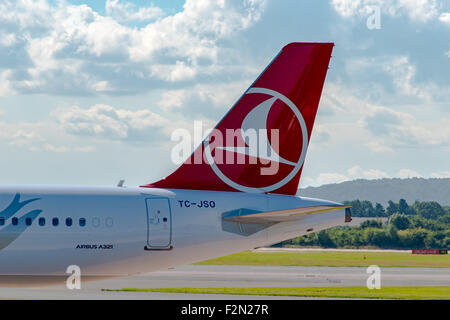 MANCHESTER, UNITED KINGDOM - AUG 07, 2015: Turkish Airlines Airbus A321 tail livery at Manchester Airport Aug 07 2015. Stock Photo
