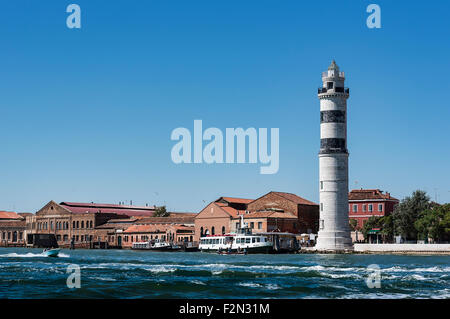 Lighthouse and glass furnaces, Murano, Venice, Italy Stock Photo