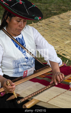Peruvian  Quechua Woman from Cusco  Demonstrating Traditional Weaving Technique. Stock Photo