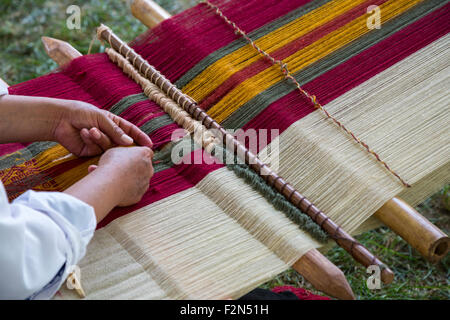 Peruvian  Quechua Woman from Cusco  Demonstrating Traditional Weaving Technique. Stock Photo
