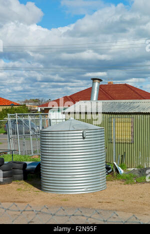 Water tank in back yard garden of a house in Adelaide, South Australia Stock Photo