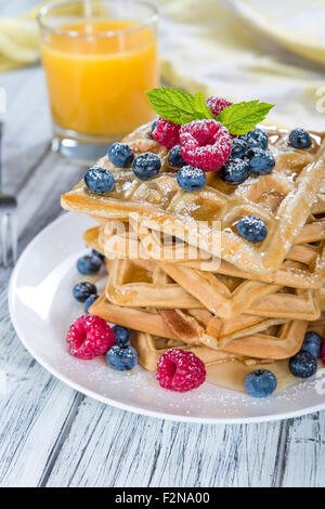 Homemade Waffles with mixed Berries and powder sugar (close-up shot) Stock Photo