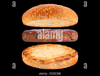 Bun and pork patty ingredient hamburger siolated on black background Stock Photo