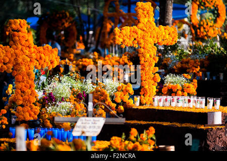 Decorated graves, covered by cempasúchil flowers, are seen during the Day of the Dead celebration in Tzintzuntzan, Mexico. Stock Photo