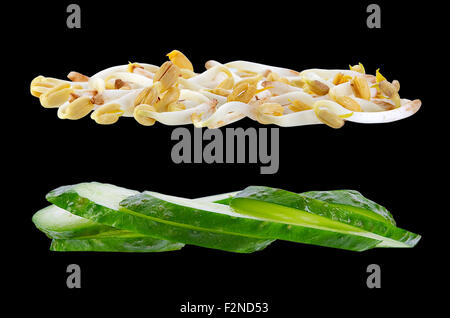 Cucumber slice and germ wheat on black background Stock Photo