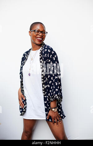 Stylish Black woman posing in dress Stock Photo