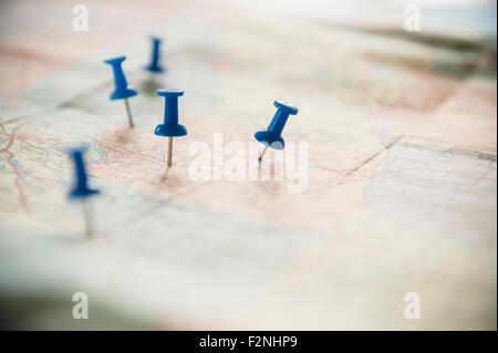 Close up of pushpins on roadmap route Stock Photo